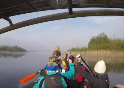 Crew paddle under Lough Lannagh Bridge, Louise Killeen as Helm and Coach